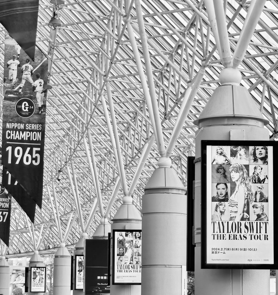 Taylor swift eras tour poster displayed outdoors