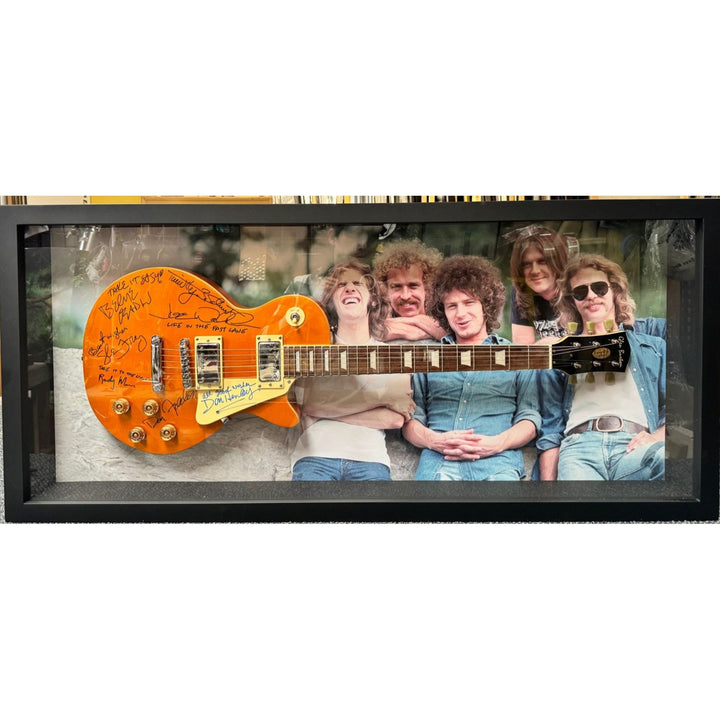 The Eagles Bernie Laden Joe Walsh Don Henley Glenn Frey Randy Meisner signed and framed full size Les Paul electric guitar with proof