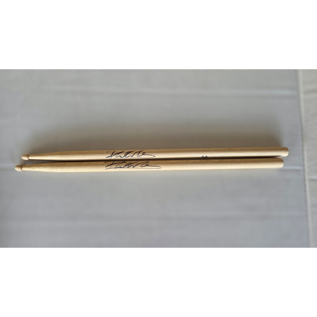 Phil Collins legendary drummer Genesis pair of drumsticks signed with proof.