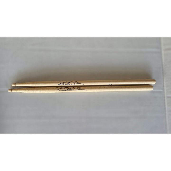 Phil Collins legendary drummer Genesis pair of drumsticks signed with proof.