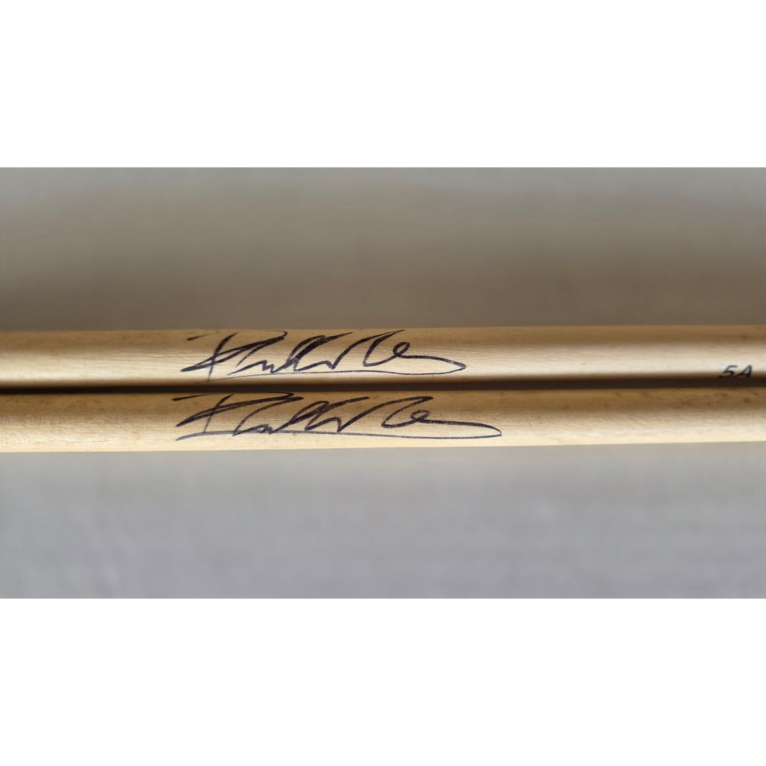 Phil Collins legendary drummer Genesis pair of drumsticks signed with proof.