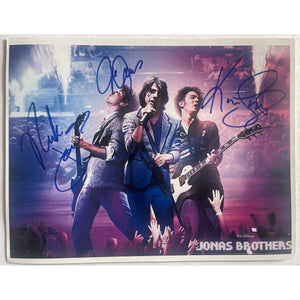 The Jonas Brothers 8x10 photo signed with proof