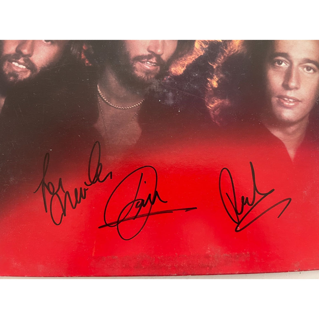 Barry, Robin and Maurice Gibb the Bee Gees Spirits Having Flown original LP signed with proof