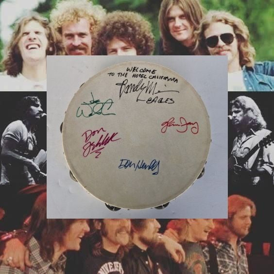 Eagles Don Henley, Don Felder, Glenn Frey, Joe Walsh, Randy Meisner with lyrics signed with proof 12" tambourine