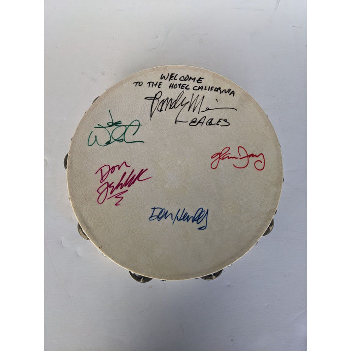 Eagles Don Henley, Don Felder, Glenn Frey, Joe Walsh, Randy Meisner with lyrics signed with proof 12" tambourine