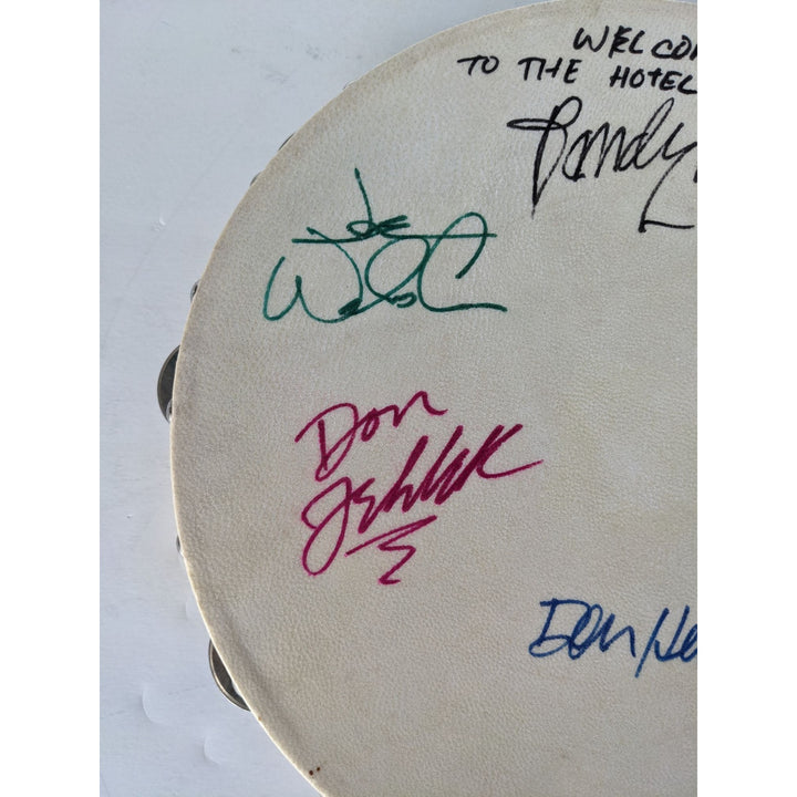 Eagles Don Henley, Don Felder, Glenn Frey, Joe Walsh, Randy Meisner with lyrics signed with proof 12" tambourine