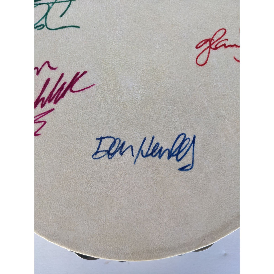 Eagles Don Henley, Don Felder, Glenn Frey, Joe Walsh, Randy Meisner with lyrics signed with proof 12" tambourine