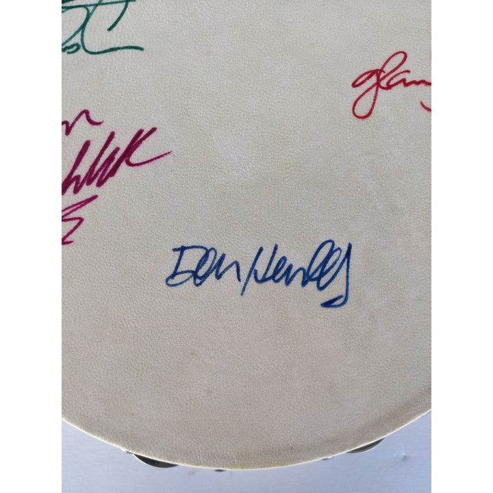 Eagles Don Henley, Don Felder, Glenn Frey, Joe Walsh, Randy Meisner with lyrics signed with proof 12" tambourine
