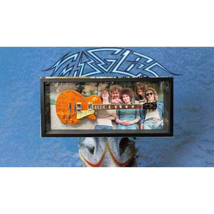 The Eagles Bernie Laden Joe Walsh Don Henley Glenn Frey Randy Meisner signed and framed full size Les Paul electric guitar with proof