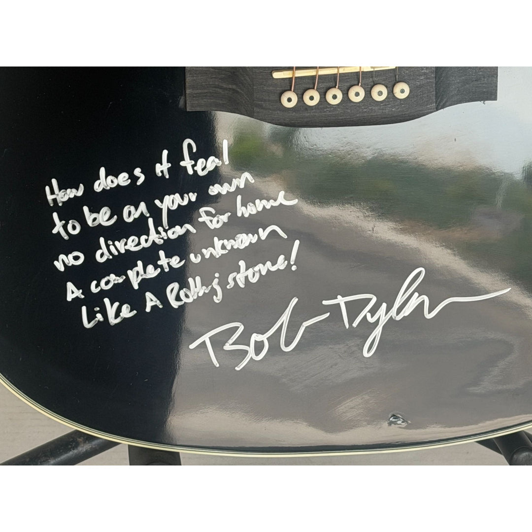 Bob Dylan acoustic guitar signed with lyrics and signing proof.