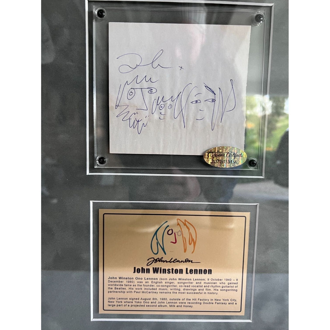 John Lennon The Beatles Co-Vocalist , Song Writer, and lead rhythm guitarist autograph book page signed with sketch & framed with proof