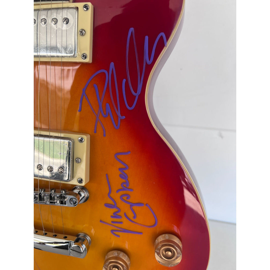 Def Leppard Joe Elliott, Rick Allen, Phil Collen, Rick Savage, Vivian Campbell, vintage cherry les paul full size electric guitar signed.