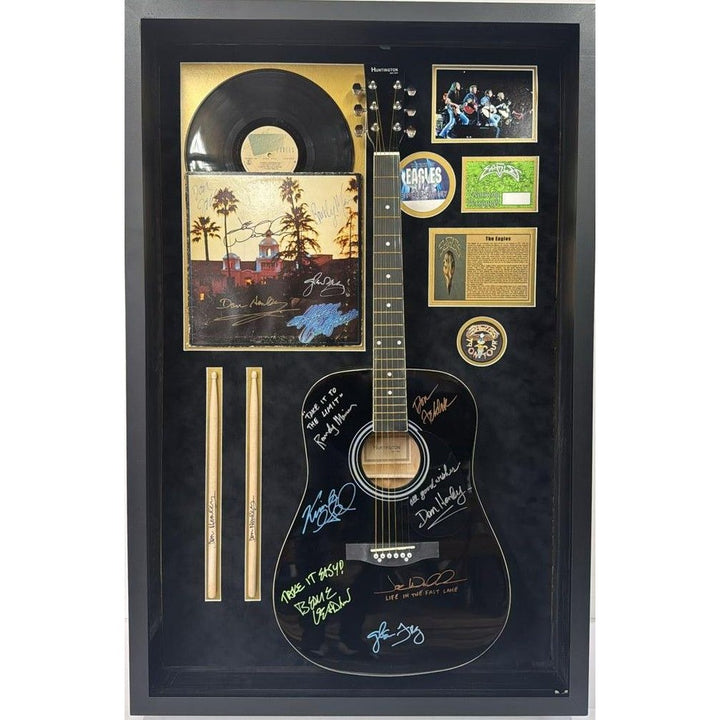 The Eagles Bernie Ladon Joe Walsh Don Henley Glenn Frey Randy Meisner Don Felder Vince Gill full size acoustic guitar signed and framed..
