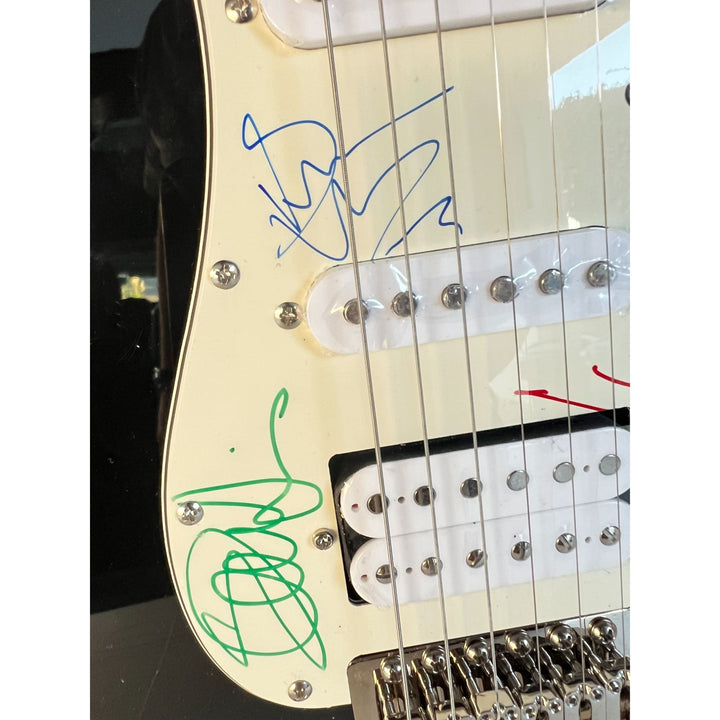 Iron Maiden full size Stratocaster electric guitar signed with proof