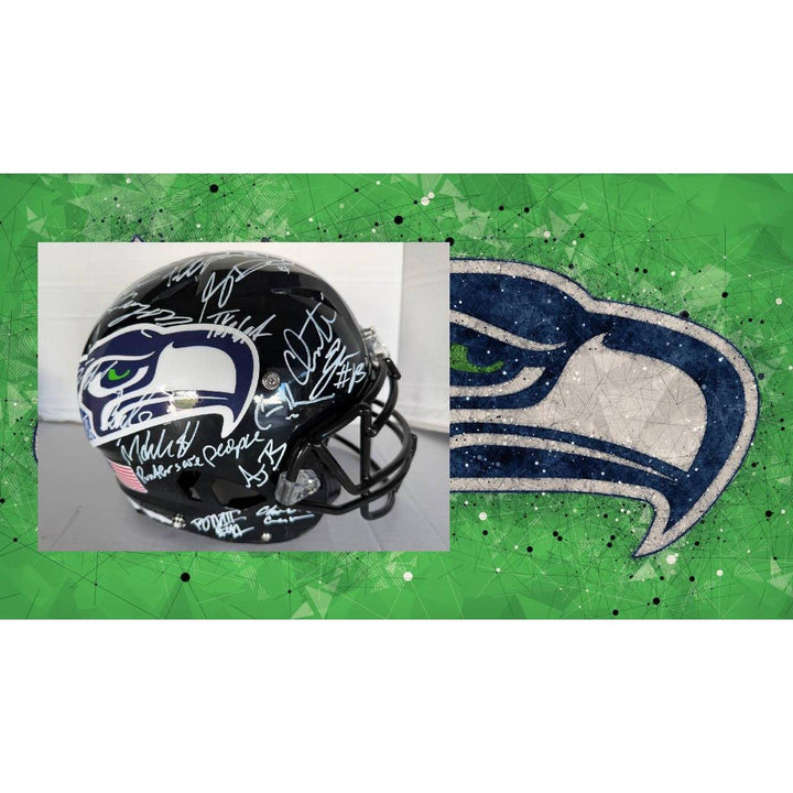 A black football helmet with signatures on a green background featuring a bird logo.