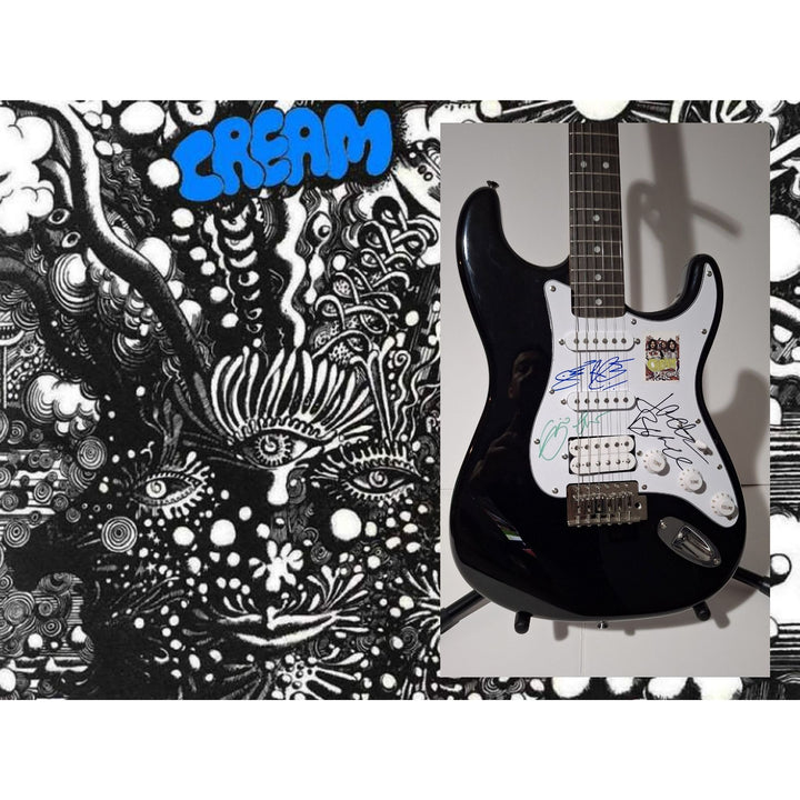 Eric Clapton, Ginger Baker, Jack Bruce, Cream, Fender Stratocaster electric guitar signed with proof