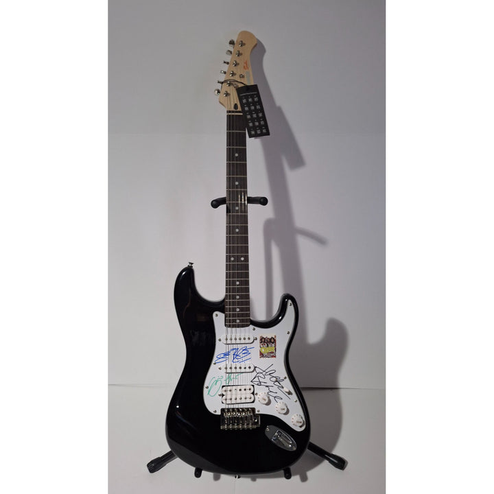 Eric Clapton, Ginger Baker, Jack Bruce, Cream, Fender Stratocaster electric guitar signed with proof