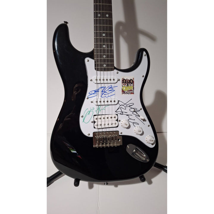 Eric Clapton, Ginger Baker, Jack Bruce, Cream, Fender Stratocaster electric guitar signed with proof