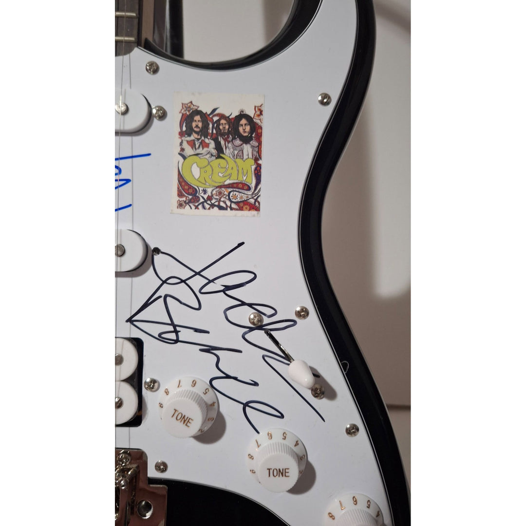 Eric Clapton, Ginger Baker, Jack Bruce, Cream, Fender Stratocaster electric guitar signed with proof