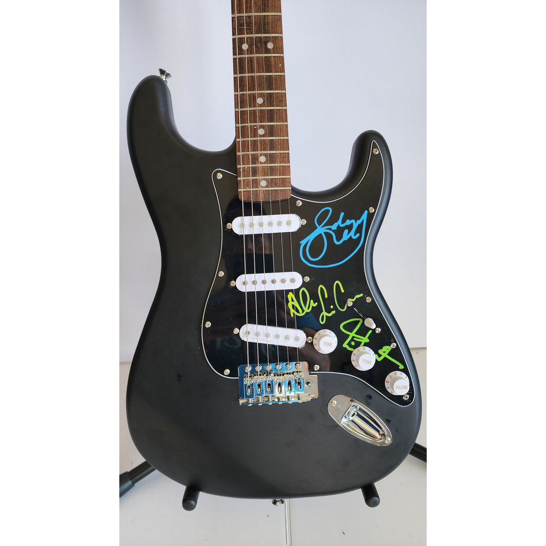 Rush Band signed Neil Peart, Geddy Lee, Alex Lifeson vintage black Fender Stratocaster full size electric guitar signed with proof