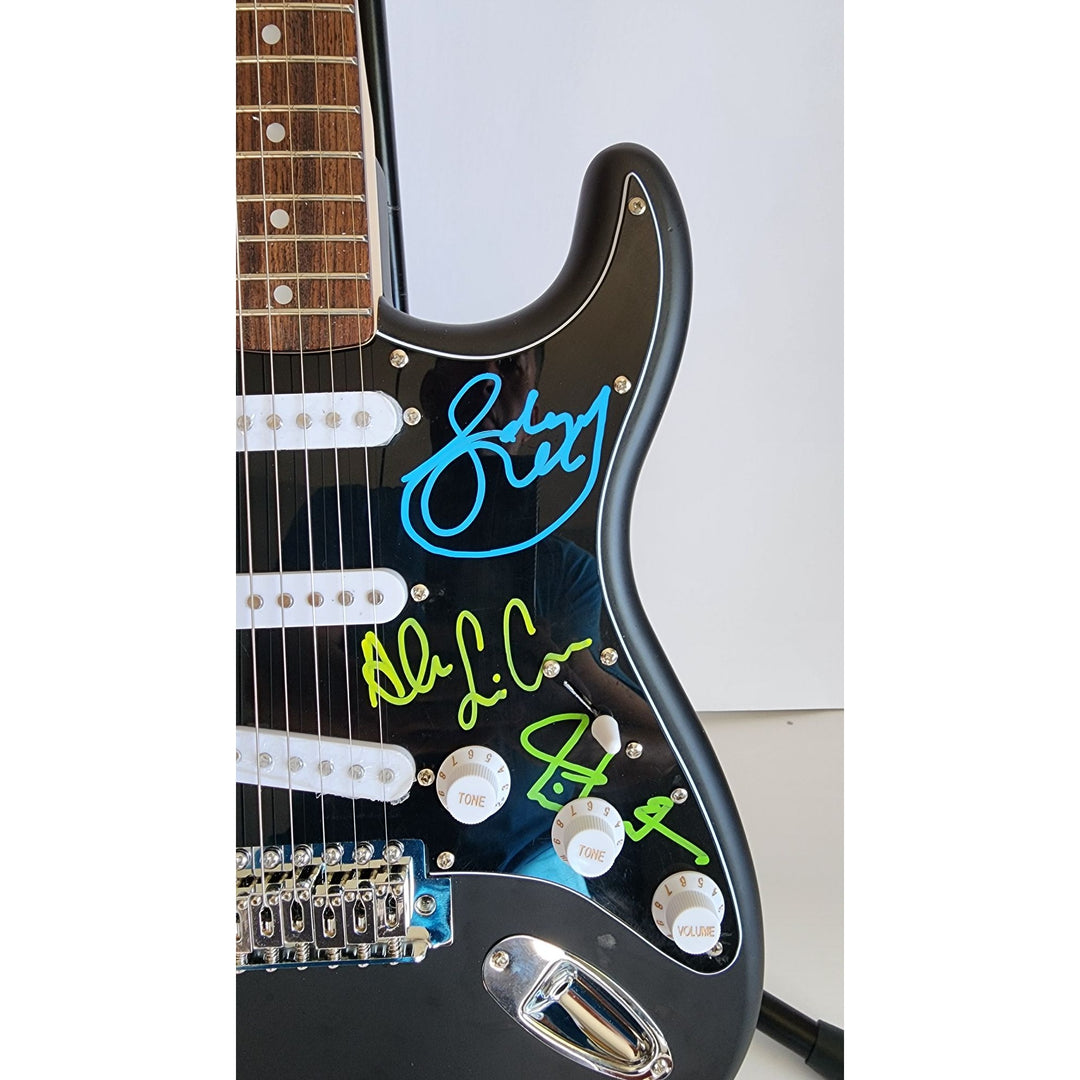 Rush Band signed Neil Peart, Geddy Lee, Alex Lifeson vintage black Fender Stratocaster full size electric guitar signed with proof
