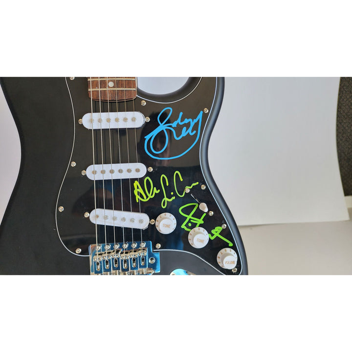 Rush Band signed Neil Peart, Geddy Lee, Alex Lifeson vintage black Fender Stratocaster full size electric guitar signed with proof