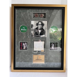 John Lennon The Beatles Co-Vocalist , Song Writer, and lead rhythm guitarist autograph book page signed with sketch & framed with proof
