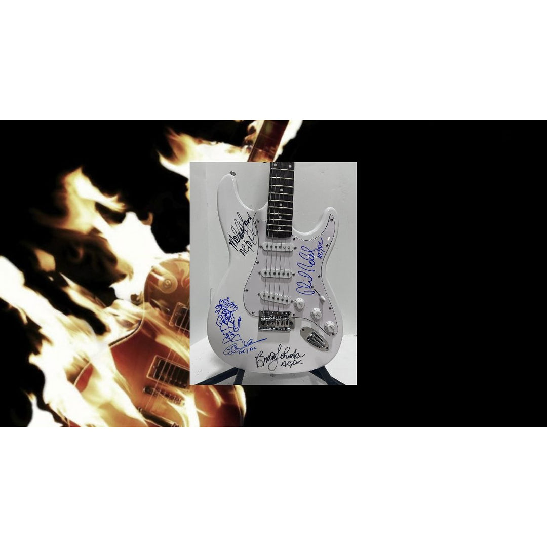 Angus Young & Malcolm Young Brian Johnston Clff Williams Phil Rudd white electric stratocaster signed with proof