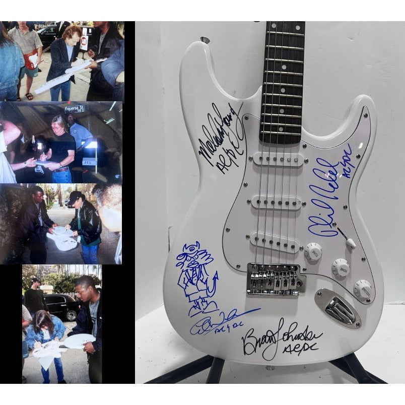 Angus Young & Malcolm Young Brian Johnston Clff Williams Phil Rudd white electric stratocaster signed with proof