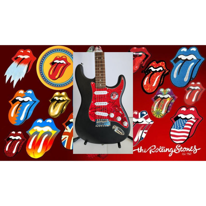 The Rolling Stones Mick Jagger, Keith Richards, Bill Wyman, Ronnie Wood, Mick Taylor, Charlie Watts Fender Stratocaster signed with proof