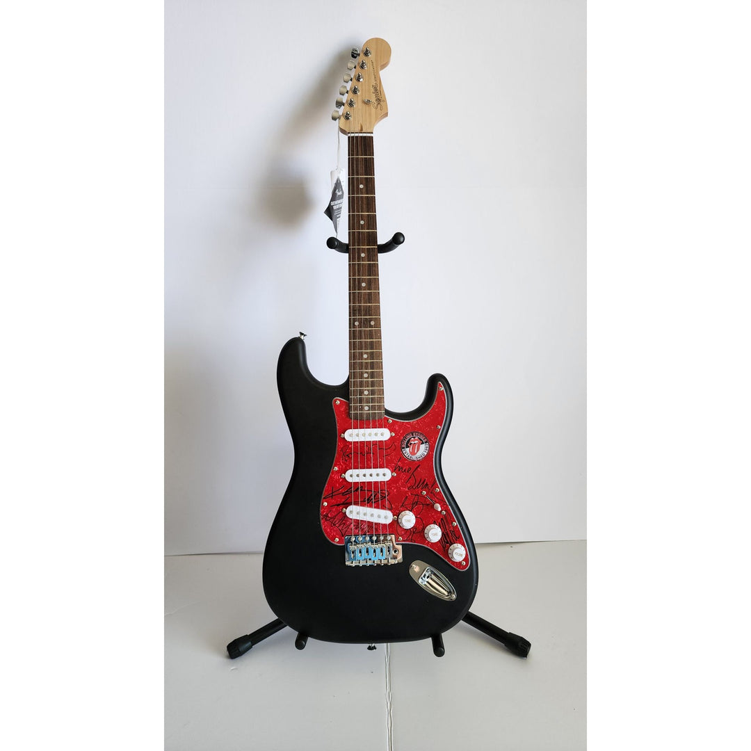 The Rolling Stones Mick Jagger, Keith Richards, Bill Wyman, Ronnie Wood, Mick Taylor, Charlie Watts Fender Stratocaster signed with proof