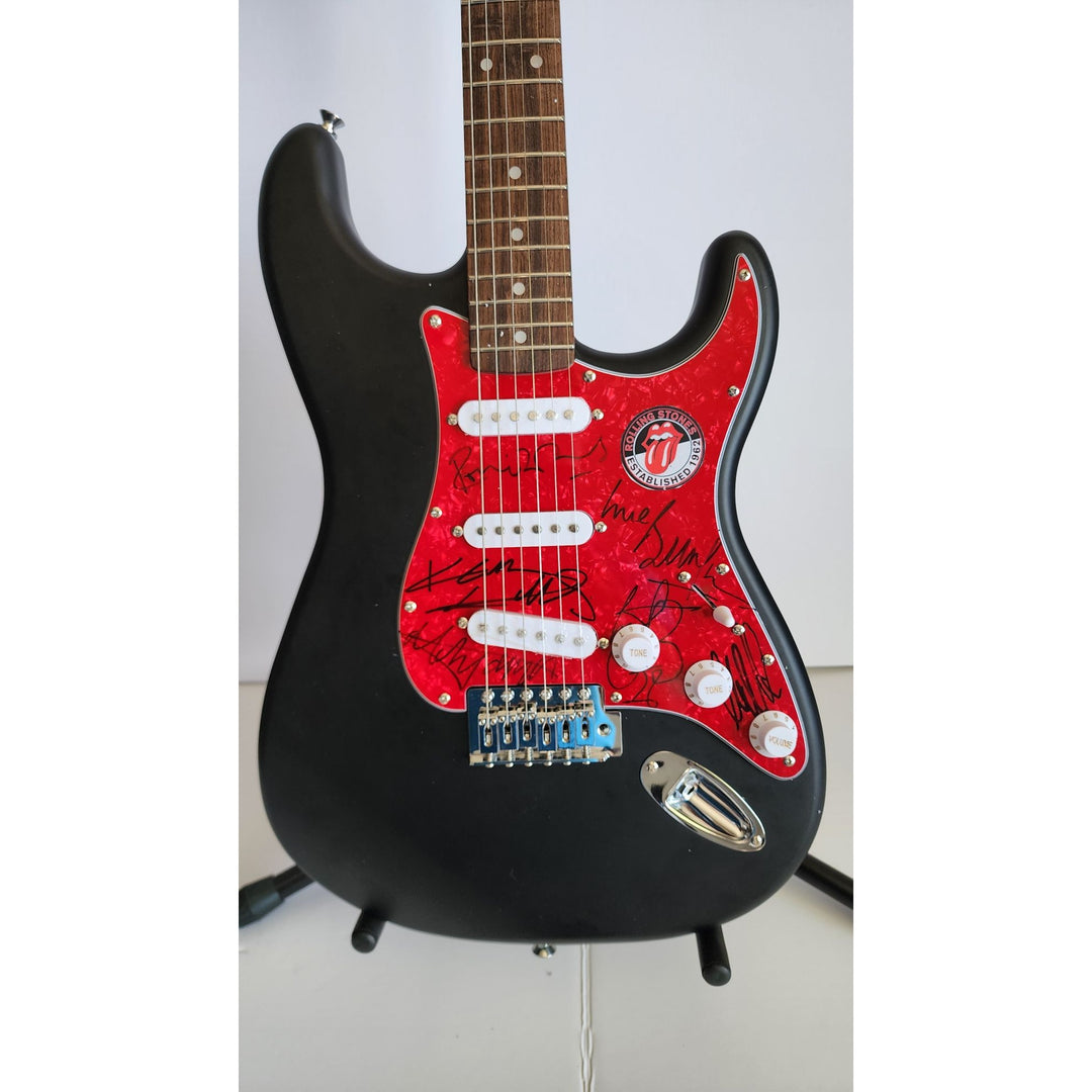 The Rolling Stones Mick Jagger, Keith Richards, Bill Wyman, Ronnie Wood, Mick Taylor, Charlie Watts Fender Stratocaster signed with proof