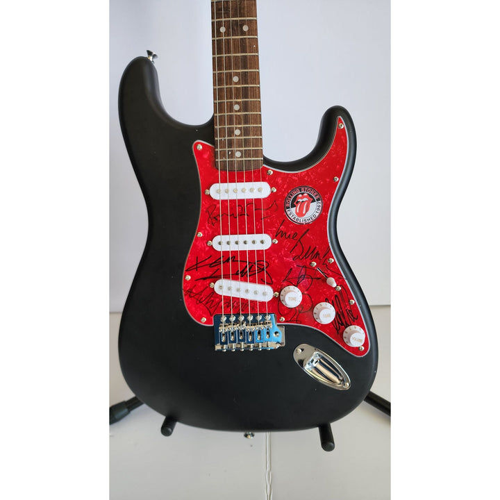 The Rolling Stones Mick Jagger, Keith Richards, Bill Wyman, Ronnie Wood, Mick Taylor, Charlie Watts Fender Stratocaster signed with proof