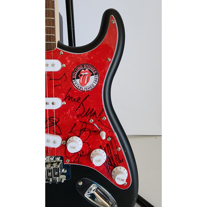 The Rolling Stones Mick Jagger, Keith Richards, Bill Wyman, Ronnie Wood, Mick Taylor, Charlie Watts Fender Stratocaster signed with proof