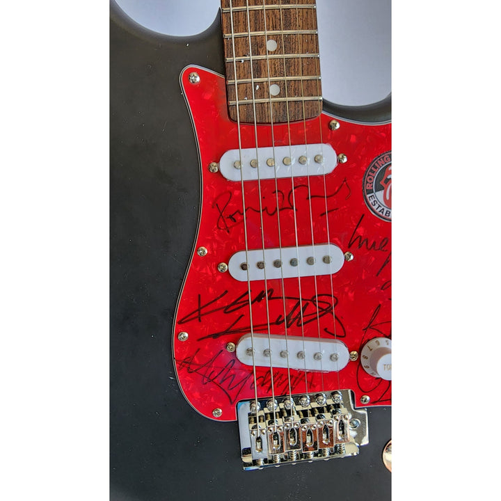 The Rolling Stones Mick Jagger, Keith Richards, Bill Wyman, Ronnie Wood, Mick Taylor, Charlie Watts Fender Stratocaster signed with proof