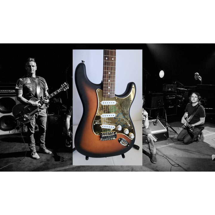 Pearl Jam Eddie Vedder, Matt McCready, Matt Cameron, Stone Gossard, Jeff Amen Fender Stratocaster Squier electric guitar signed with proof