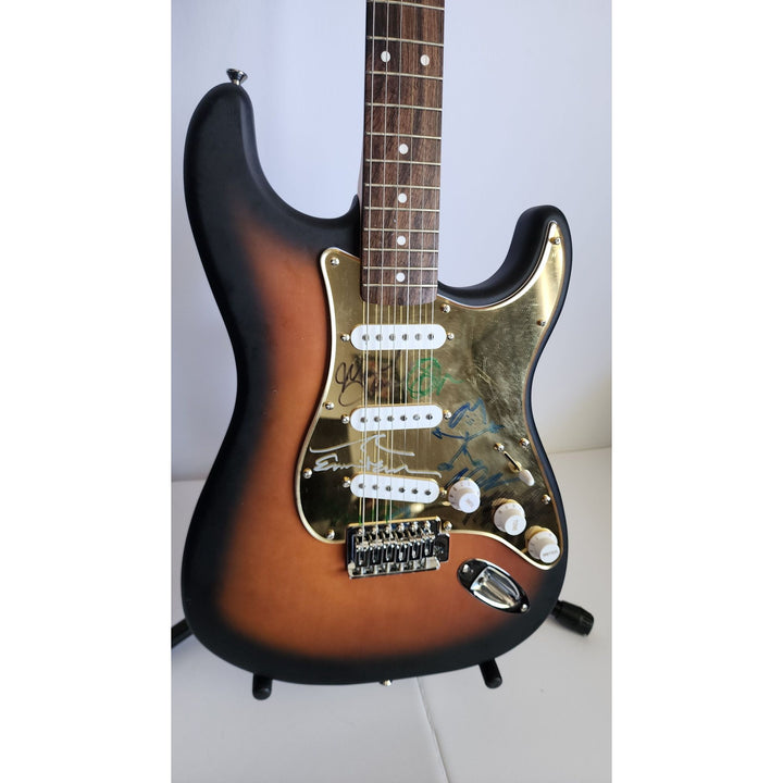 Pearl Jam Eddie Vedder, Matt McCready, Matt Cameron, Stone Gossard, Jeff Amen Fender Stratocaster Squier electric guitar signed with proof