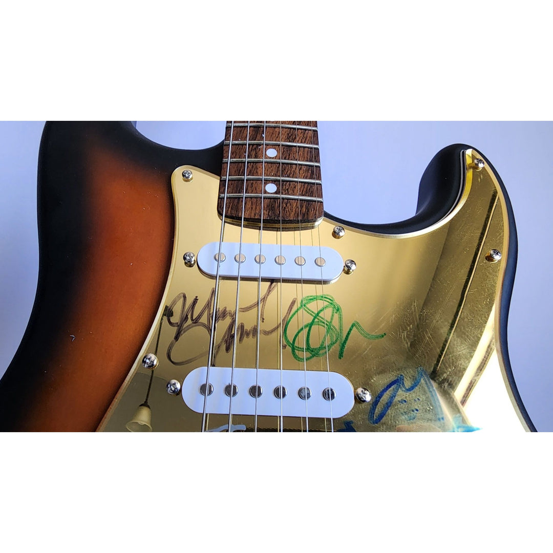 Pearl Jam Eddie Vedder, Matt McCready, Matt Cameron, Stone Gossard, Jeff Amen Fender Stratocaster Squier electric guitar signed with proof