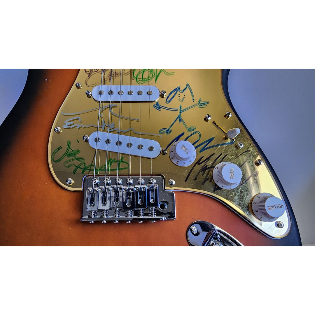 Pearl Jam Eddie Vedder, Matt McCready, Matt Cameron, Stone Gossard, Jeff Amen Fender Stratocaster Squier electric guitar signed with proof