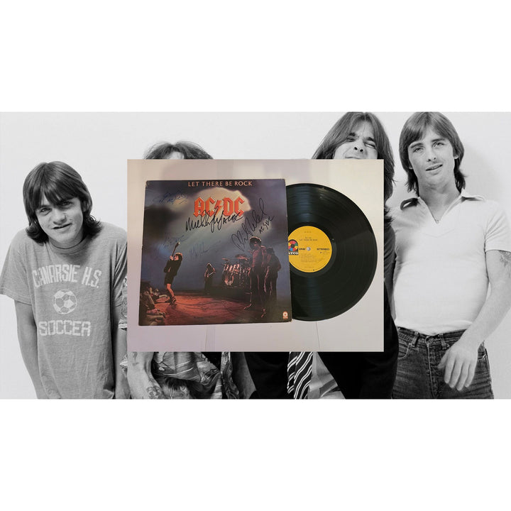 Angus young Malcolm Young Brian Johnson Cliff Williams Phil Rudd AC DC Let there be rock lp signed with proof.