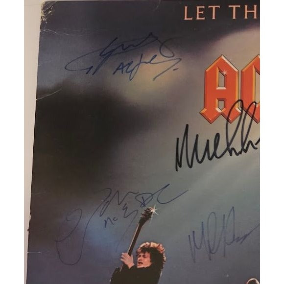 Angus young Malcolm Young Brian Johnson Cliff Williams Phil Rudd AC DC Let there be rock lp signed with proof.