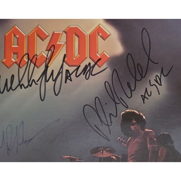 Angus young Malcolm Young Brian Johnson Cliff Williams Phil Rudd AC DC Let there be rock lp signed with proof.