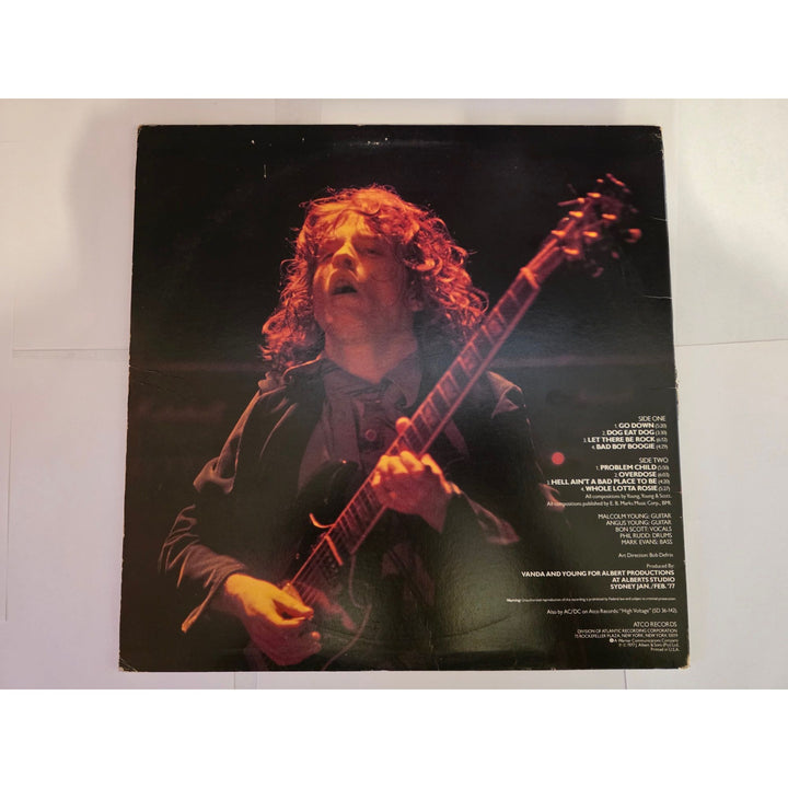 Angus young Malcolm Young Brian Johnson Cliff Williams Phil Rudd AC DC Let there be rock lp signed with proof.