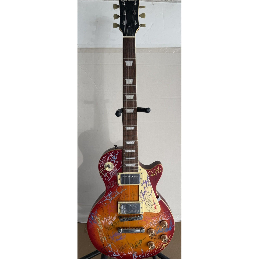 Guitar legends 36 signed in all Angus Young Paul Simon Jimmy Page David Gilmour Les Paul guitar signed with full provenance and photo proof.