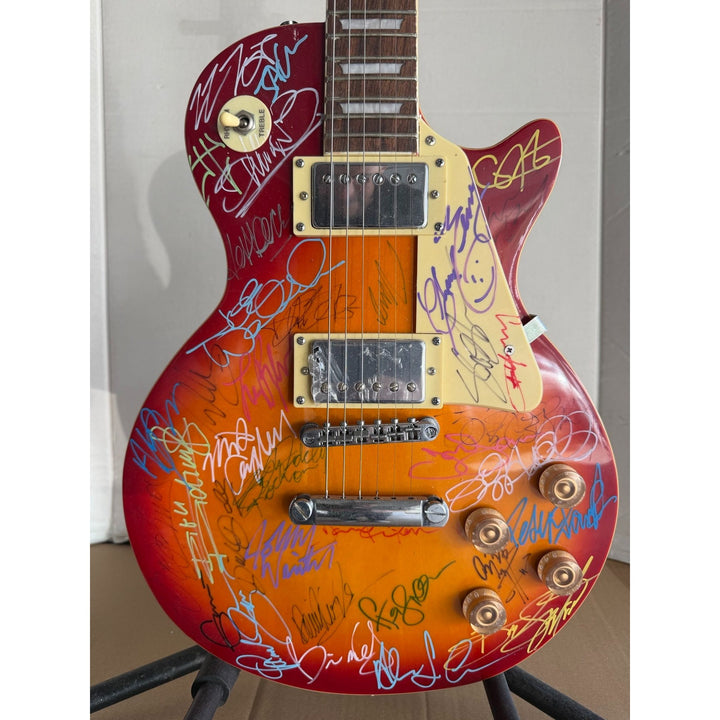 Guitar legends 36 signed in all Angus Young Paul Simon Jimmy Page David Gilmour Les Paul guitar signed with full provenance and photo proof.