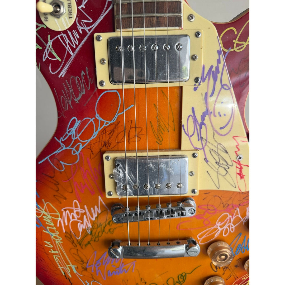 Guitar legends 36 signed in all Angus Young Paul Simon Jimmy Page David Gilmour Les Paul guitar signed with full provenance and photo proof.