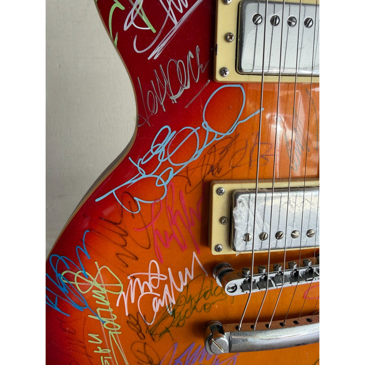 Guitar legends 36 signed in all Angus Young Paul Simon Jimmy Page David Gilmour Les Paul guitar signed with full provenance and photo proof.