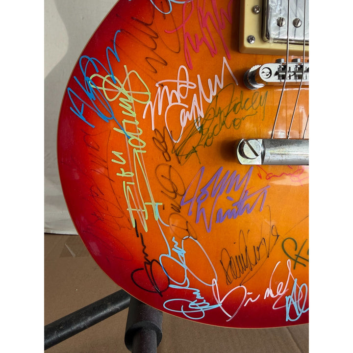 Guitar legends 36 signed in all Angus Young Paul Simon Jimmy Page David Gilmour Les Paul guitar signed with full provenance and photo proof.
