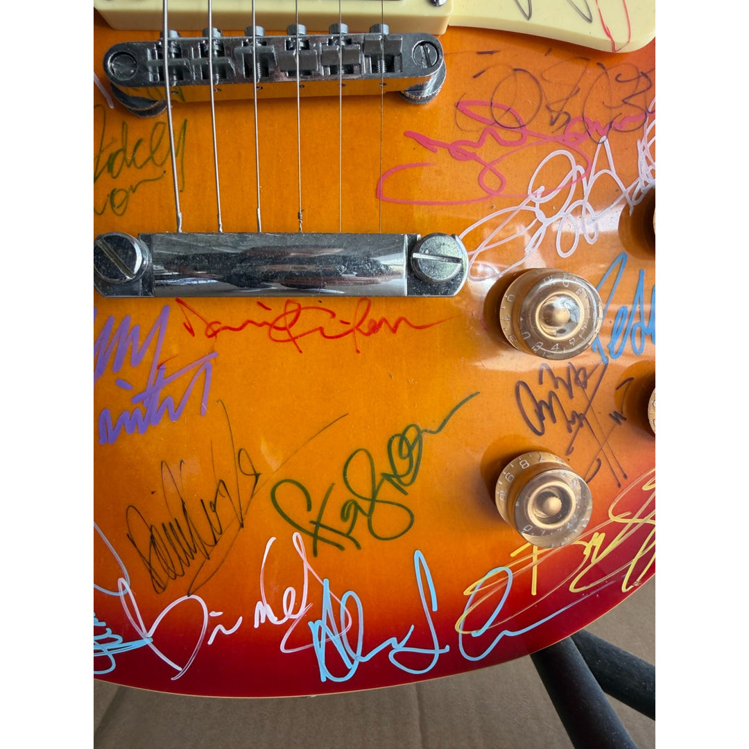 Guitar legends 36 signed in all Angus Young Paul Simon Jimmy Page David Gilmour Les Paul guitar signed with full provenance and photo proof.