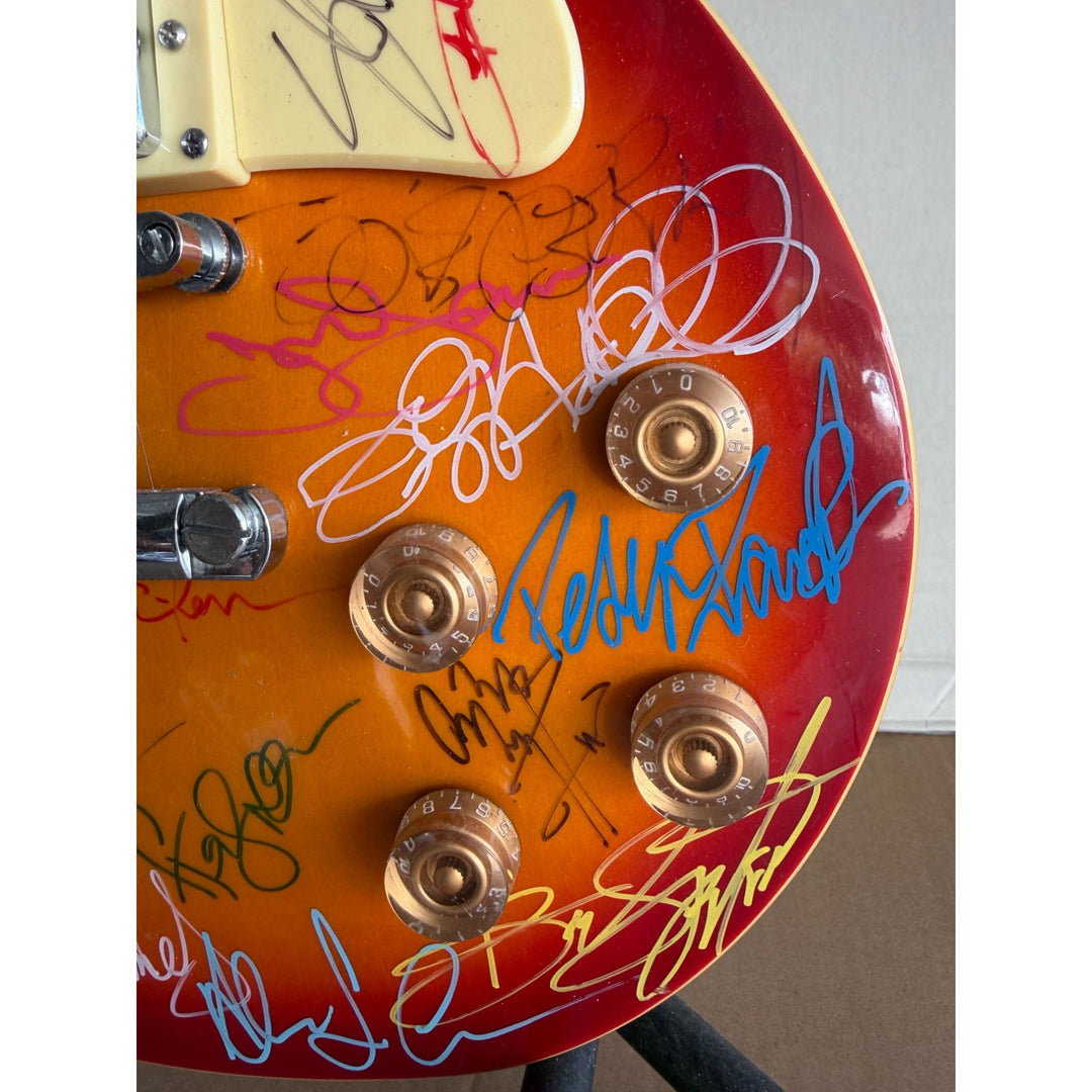 Guitar legends 36 signed in all Angus Young Paul Simon Jimmy Page David Gilmour Les Paul guitar signed with full provenance and photo proof.